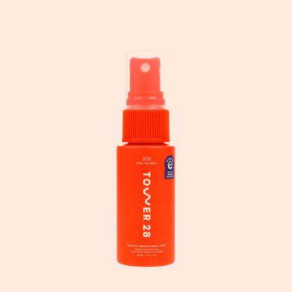 1oz Travel sized bottle of SOS Daily Rescue Facial Spray on neutral background